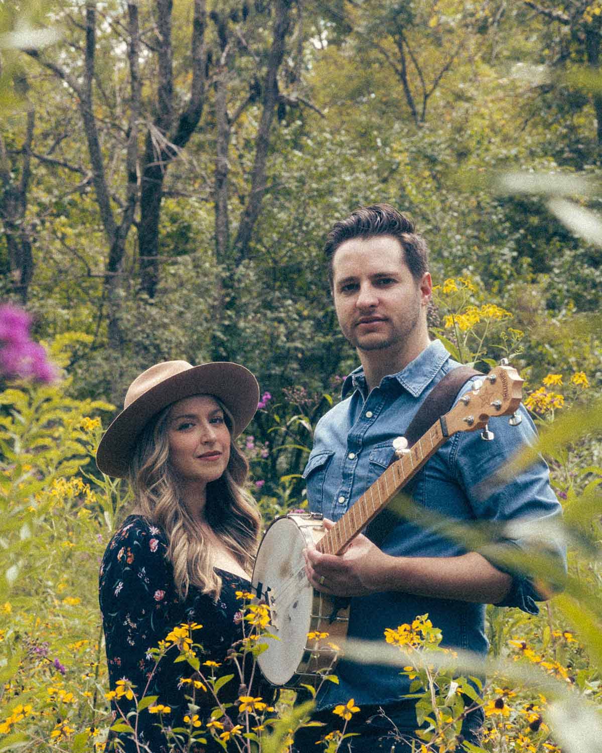 The Laurelys in front of a garage door