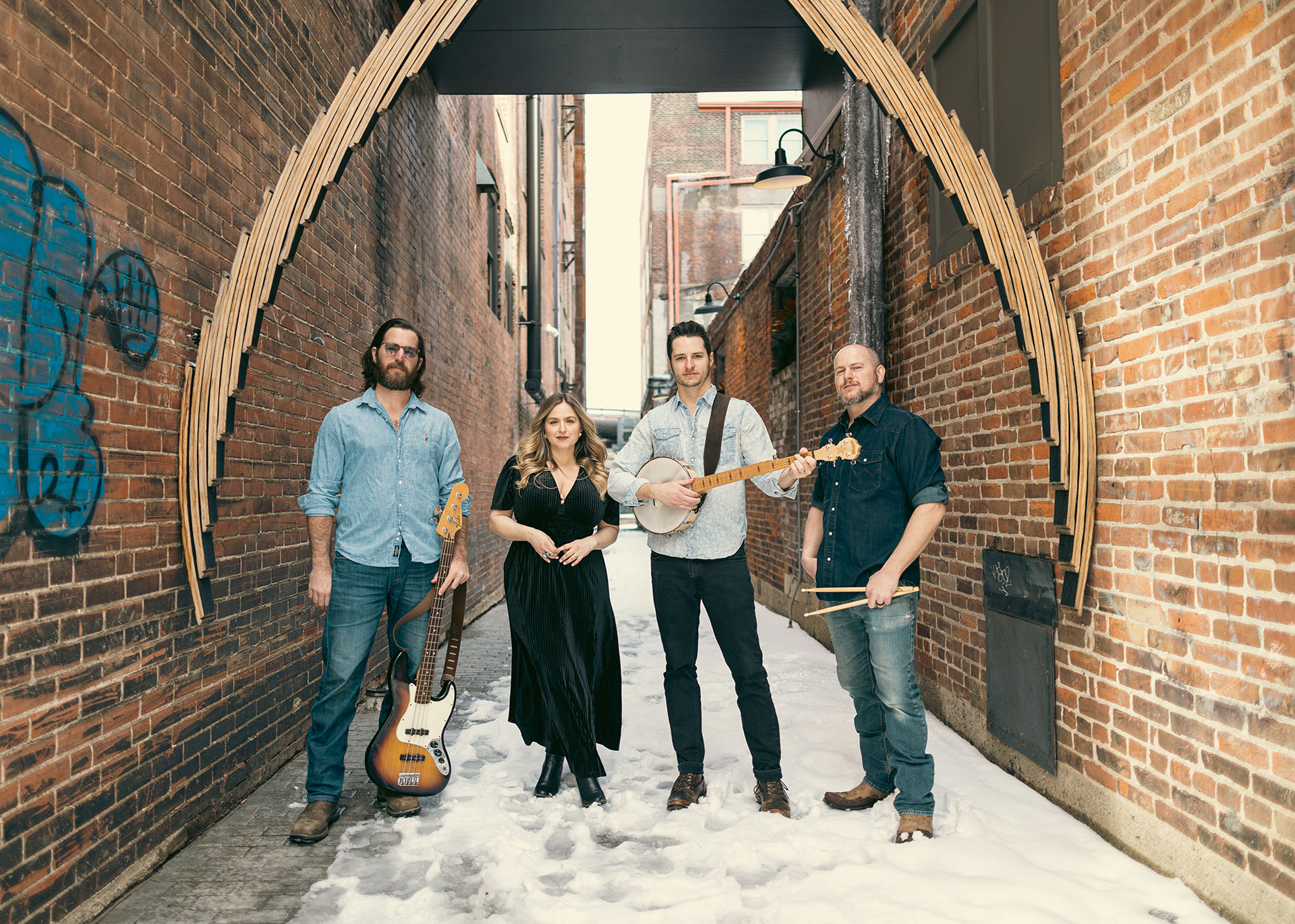 The Laurelys in front of a garage door